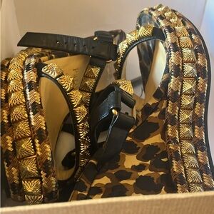 Christian Louboutin Black and Gold Heels